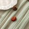 120-inch (10 ft) green cheesecloth table runner, perfect for adding a rustic boho touch to weddings, baby showers, bridal showers, or home décor. This sheer gauze runner serves as an elegant centerpiece, ideal for creating a soft, textured look on an